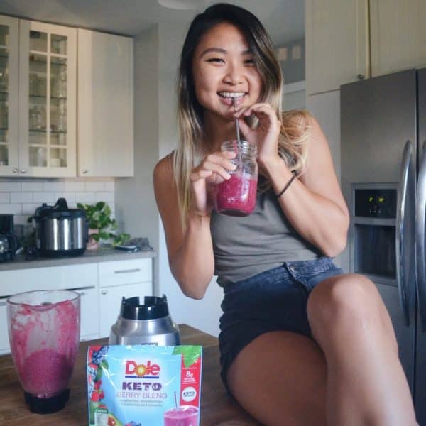 Woman drinking Dole berry smoothie